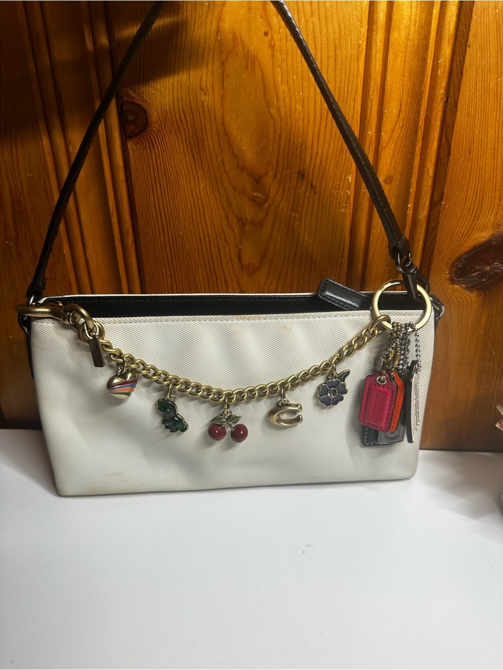 Coach White Shoulder Bag with Black Trim and Charm Chain